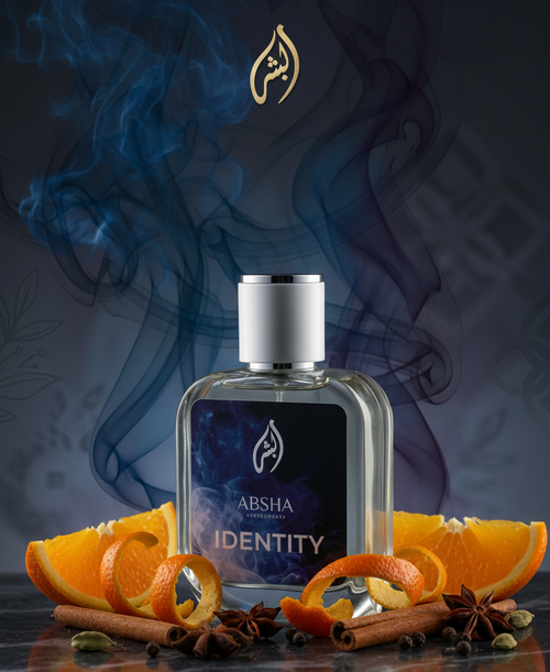 IDENTITY Perfume with oranges and spices on dark marble